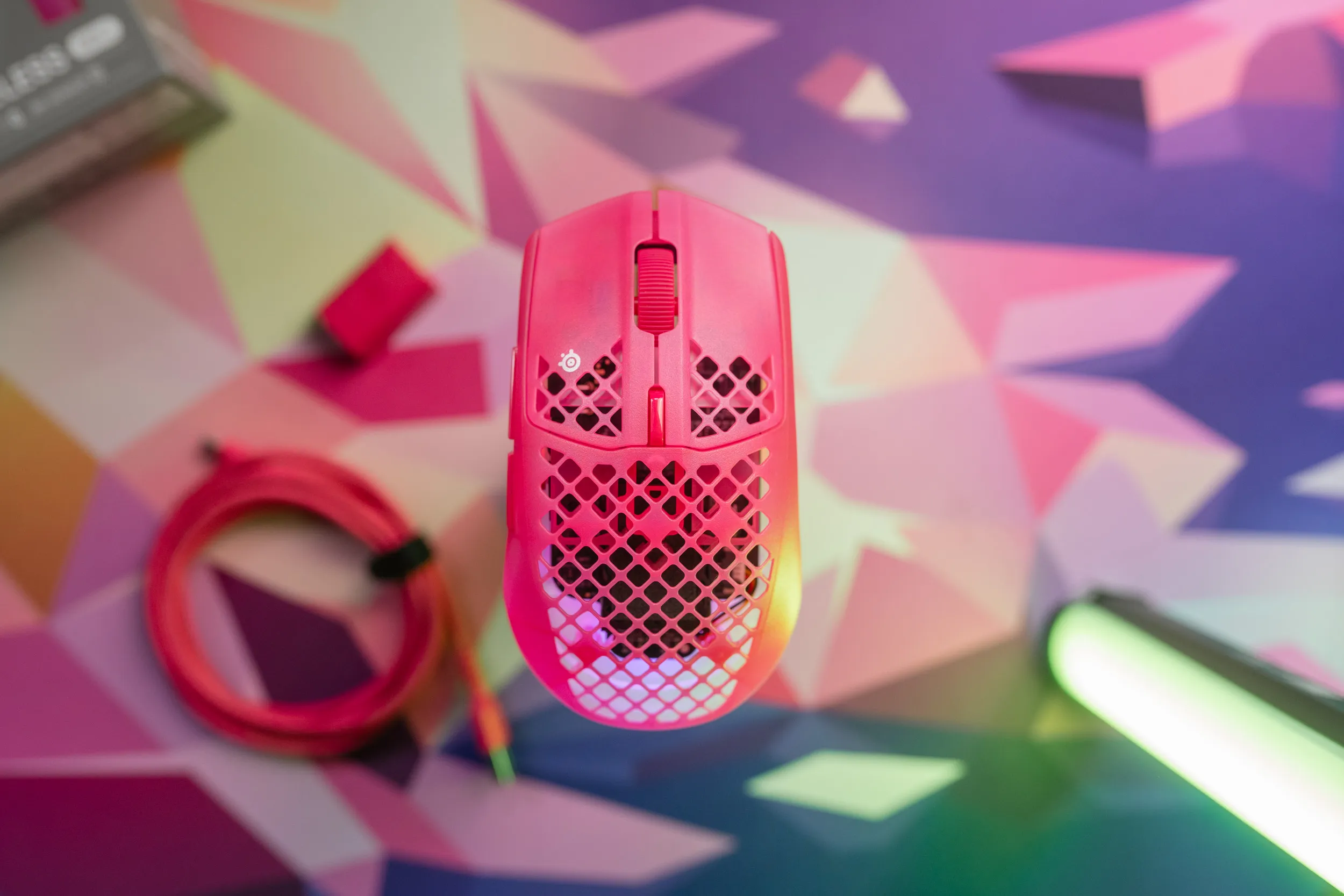 Aerox 3 Wireless Gen 2 from above with RGB light shining through the holes in the shell