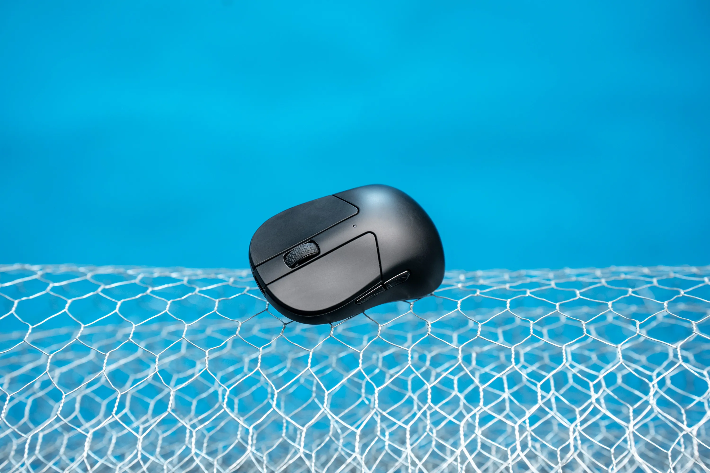 Keychron M4 in a blue background