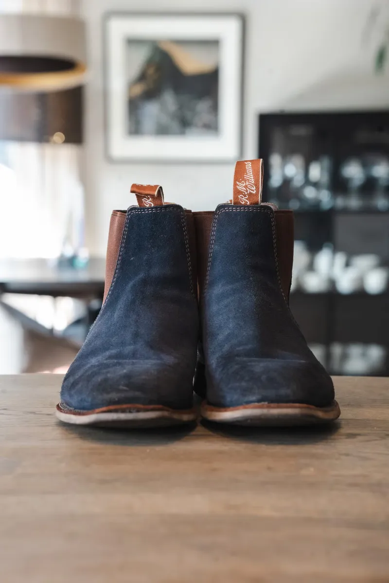 The blue suede pair seen straight from the front with brown R.M. Williams loops