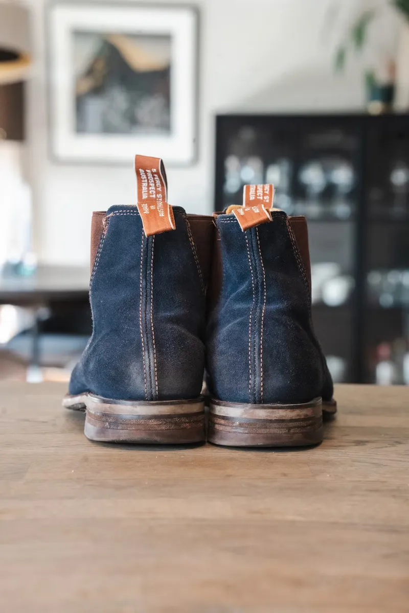 The blue suede pair seen from behind with loops front and back