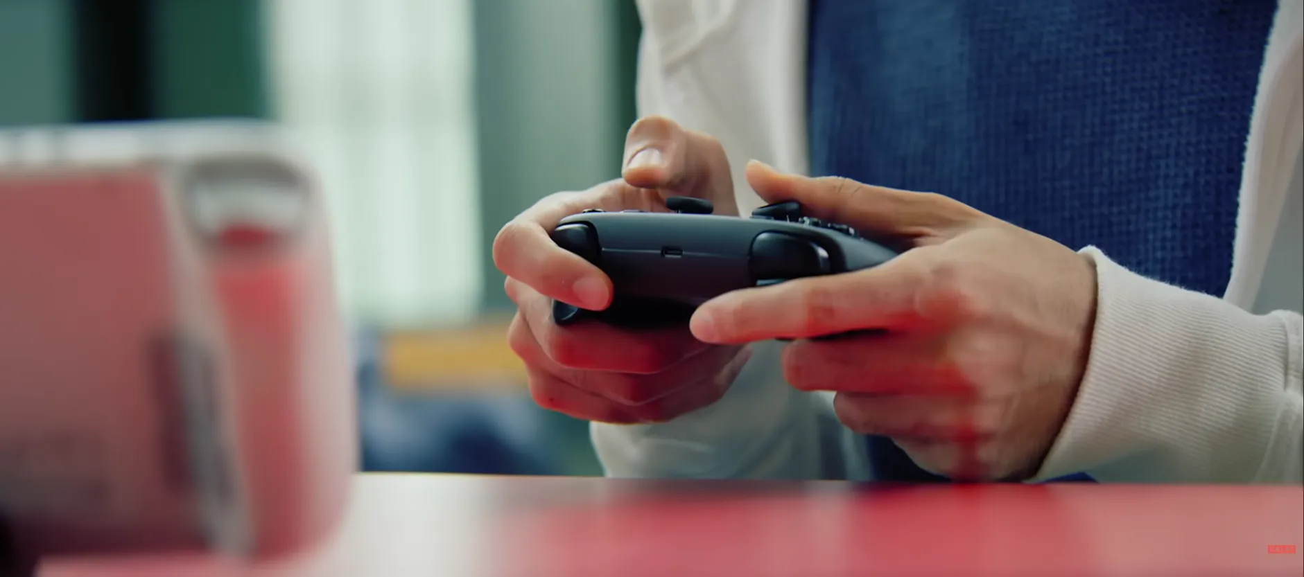 Close-up of hands holding a Steam Controller
