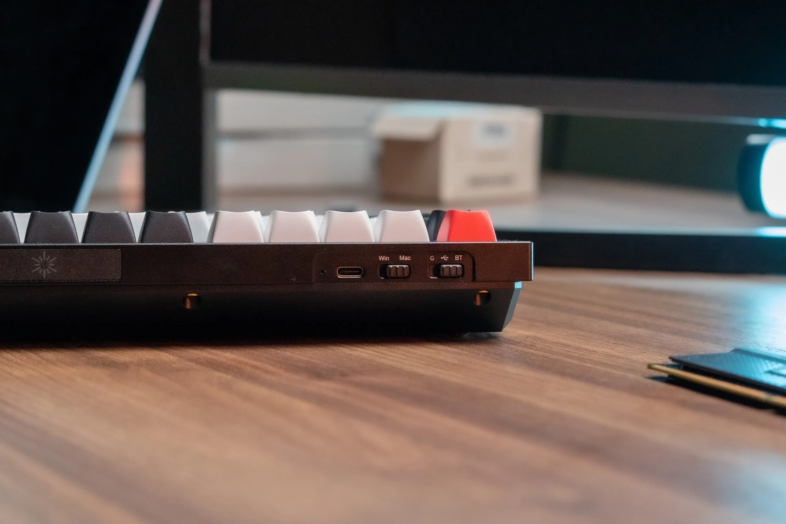 The back of the Keychron Q1 HE with USB-C port, OS switch and connection mode switch