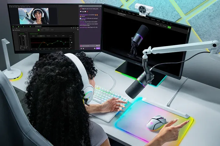Razer Seiren V3 Pro mounted on an arm in a white streaming setup