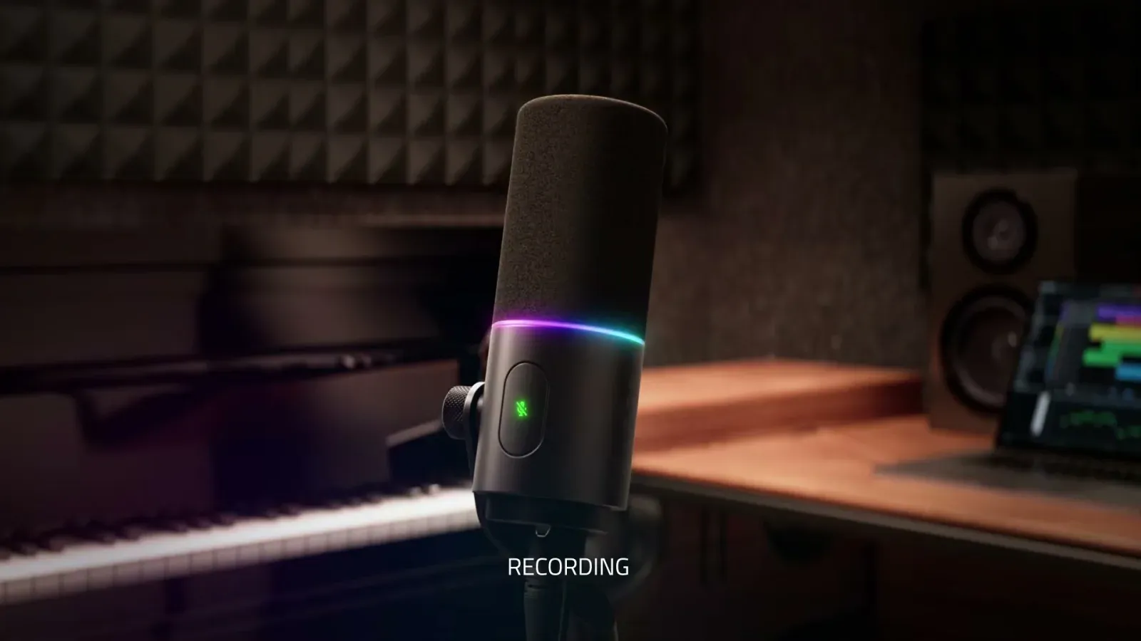 Razer Seiren V3 Pro in an acoustically treated studio with a piano in the background